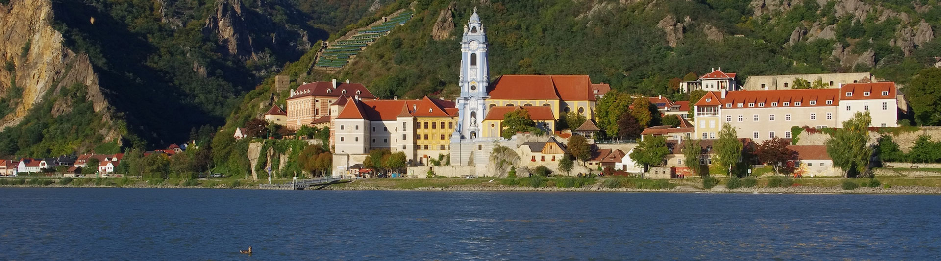 Dürnstein and its blue baroque abbey tower on the Danube in the Wachau Valley